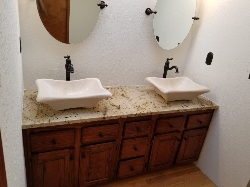 Double bathroom vanity with quartz remnant top and two undermount sinks, part of Tops Countertops’ 5–7 day Remnant Vanity Tops Pickup Program.