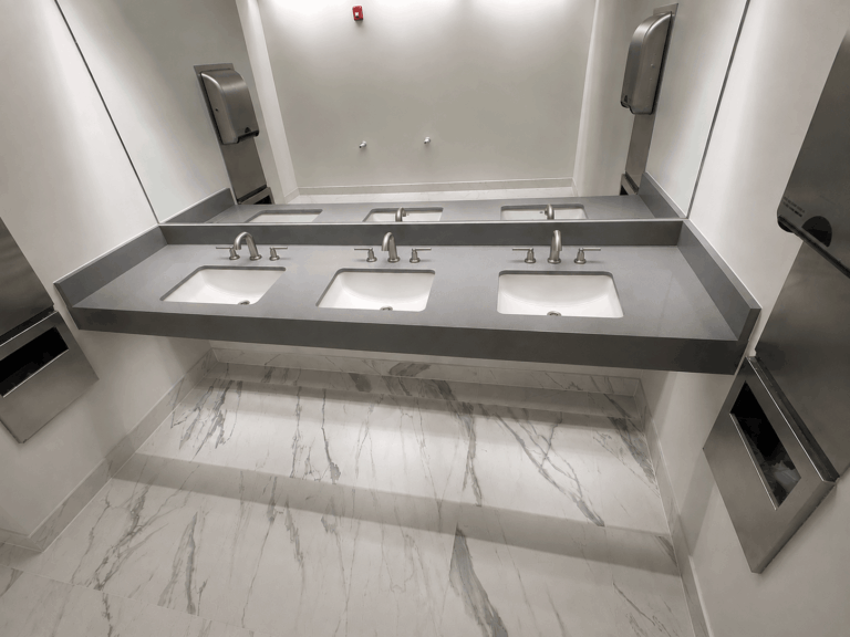 Commercial Work Macabo Gray Quartz Commercial Work City of Centralia Reynolds Avenue Facility Break Room Himalaya White Quartz Countertops Saratoga Soapstone Kitchen Gray Nuevo Brushed Granite Installed by Tops Countertops in South Puget Sound for Cornerstore