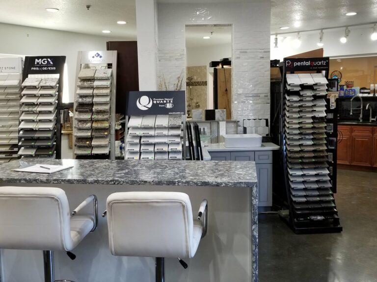 Tops Countertops design center in Lacey with quartz and granite sample displays and a consultation counter