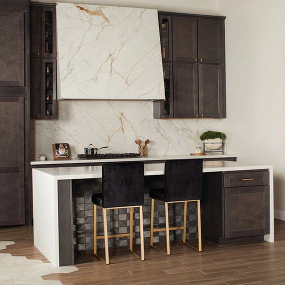 MSI Stile Porcelain Slab Countertops with matching porcelain cladding for the backsplash and over the range hood. Large format porclain slabs offer versatile design choices!