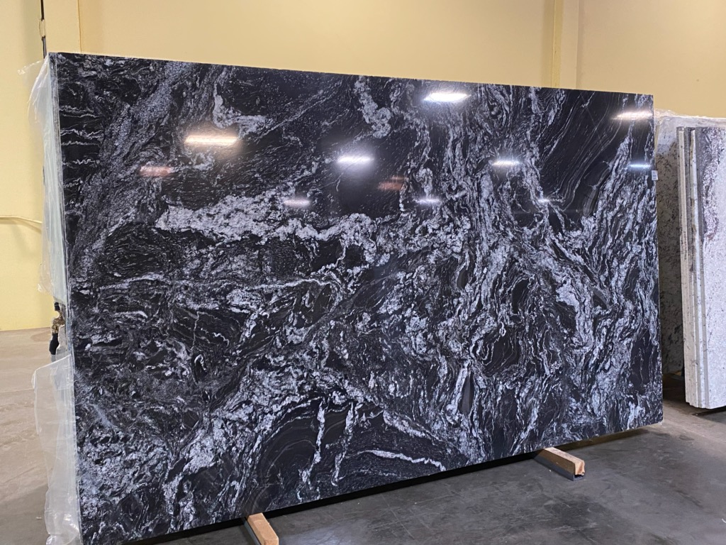 Polished black and white granite slab with dramatic veining on display at Tops Countertops in Lacey, WA, the best countertop company in the South Sound area.