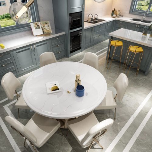 Quartz Circular tabletop, countertops, dark grey wood cabinets.