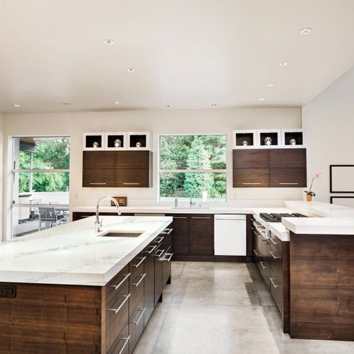 White Quartz Countertop w/ natural wood cabinets.