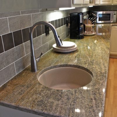 TOPS Kitchen Remodel: Second sink (circular undermount) with granite countertops and tile backsplash.